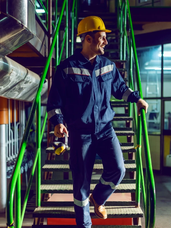 IPTANKS certified industrial worker demonstrating safety protocols at Gulf Coast chemical storage facility with MC-307 DOT407 tank trailer